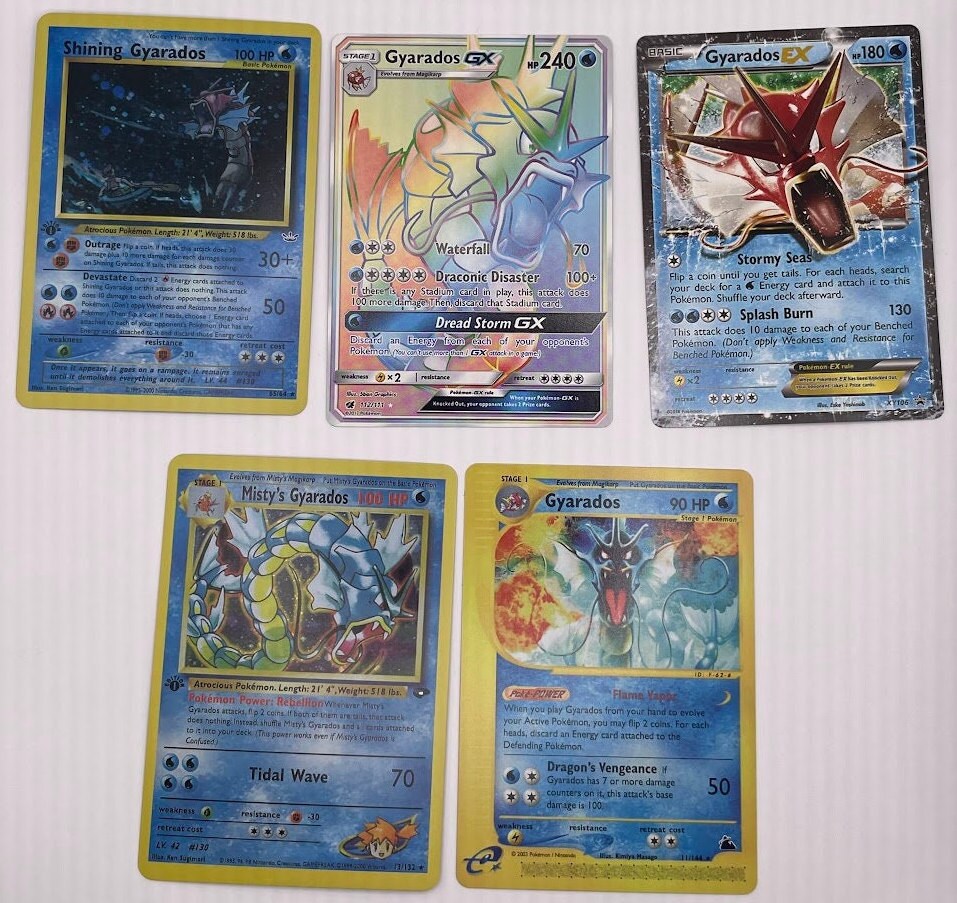 Gyarados Reprint Bundle Lot of 12 - Base Set 2, Base Set First Edition, Team Rocket, Gym Challenge, Neo Revelation, Skyridge-Evolving Skies