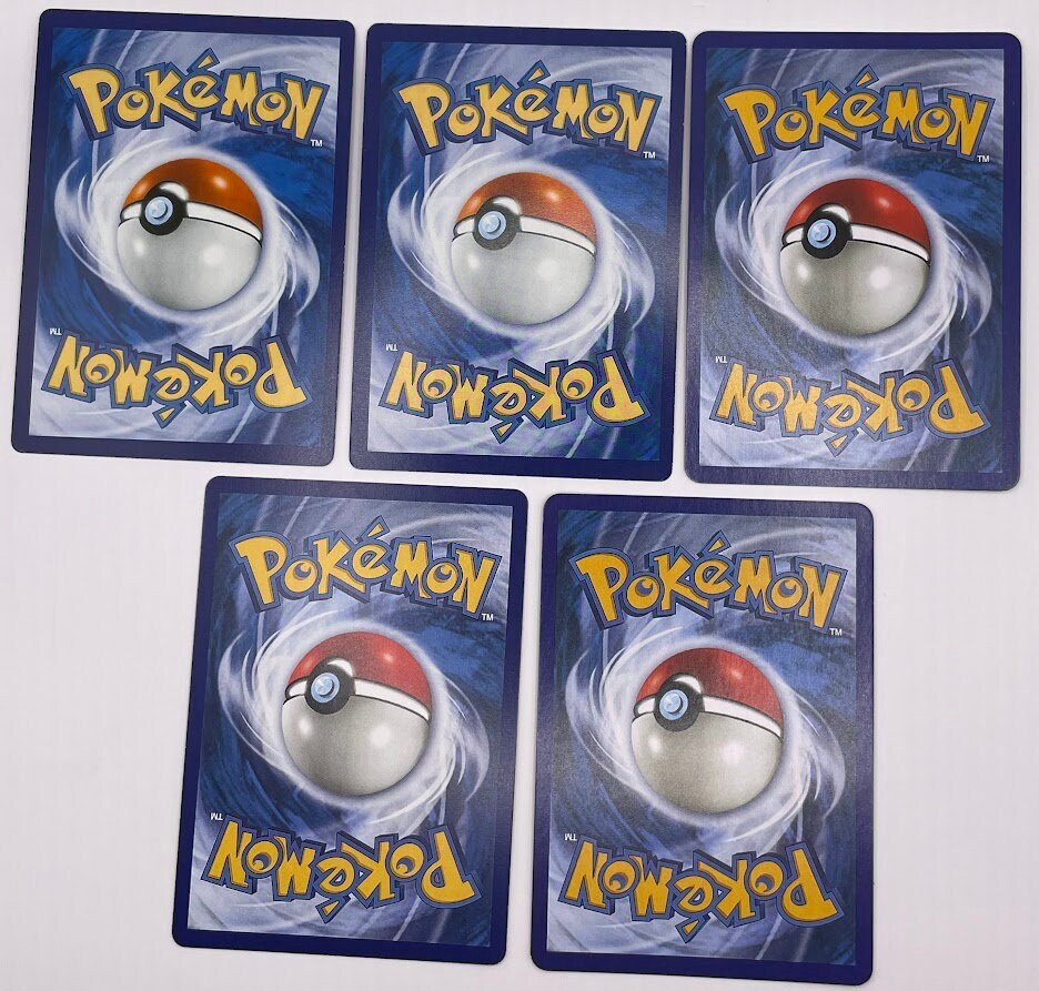 Gyarados Reprint Bundle Lot of 12 - Base Set 2, Base Set First Edition, Team Rocket, Gym Challenge, Neo Revelation, Skyridge-Evolving Skies